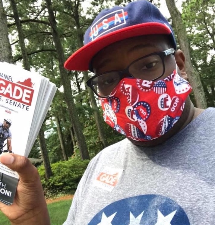 Thomas Turner hands out literature for GOP Senate hopeful Daniel Gade.