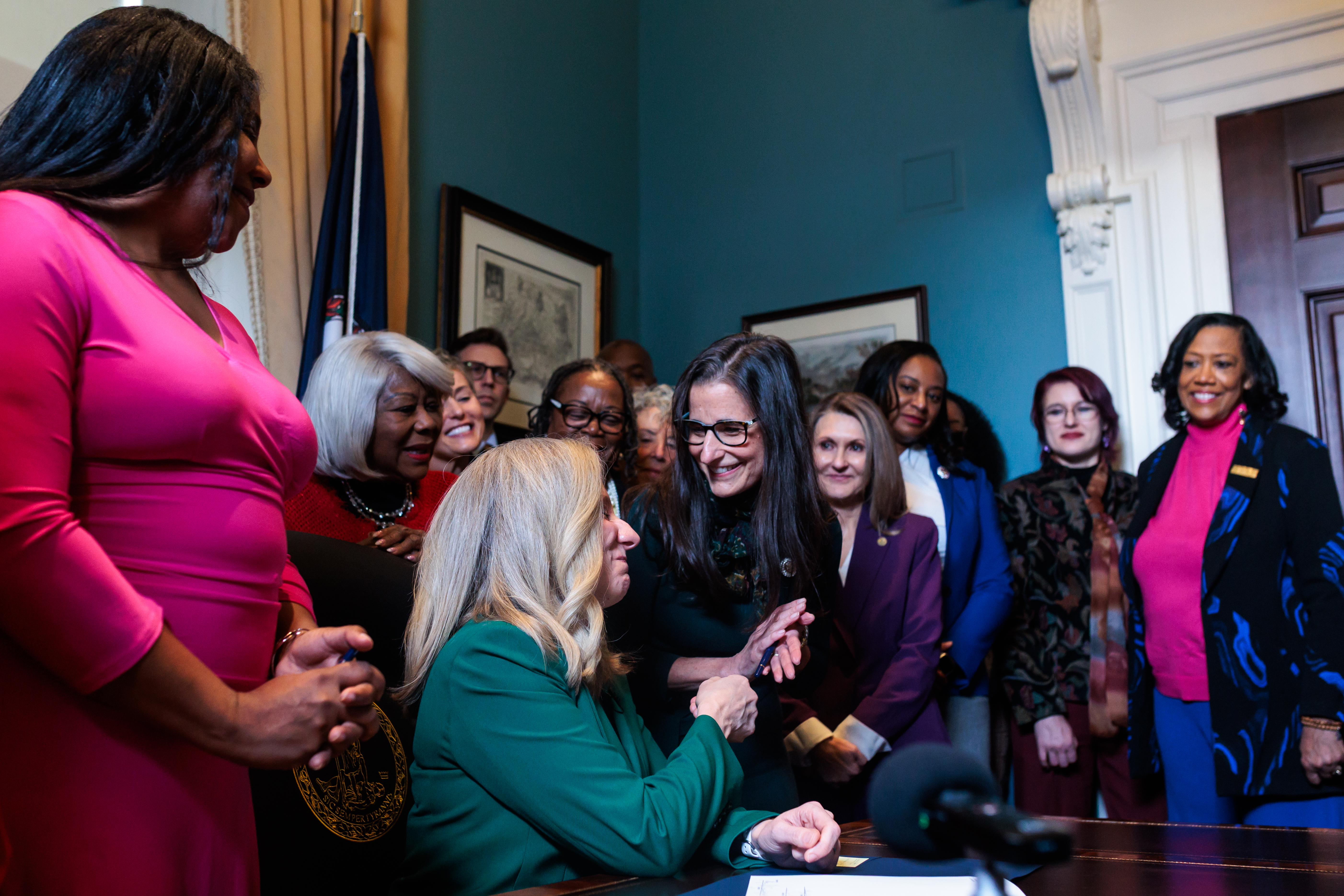Spanberger signs bill moving redistricting vote one step closer 1 Gov. Abigail Spanberger gives state Sen. Jennifer Boysko (D–Fairfax), the sponsor of a proposed constitutional amendment enshrining a fundamental right to reproductive freedom, the pen she used to sign the bill on Friday, February 6, 2026 at the Virginia State Capitol in Richmond.