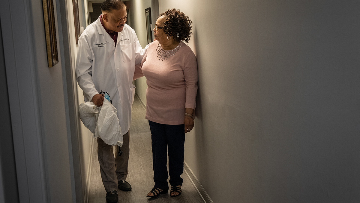 Virginia medical schools aim to recruit Black doctors 2 Dr. Richard Jackson chats with Brenda Jeffers-Spain, his patient.