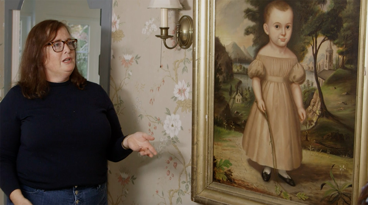 Legacy List Transforms a Venerable Family House into a Place that Feels Like Home 1 Bess talks about one of the paintings in her house.
