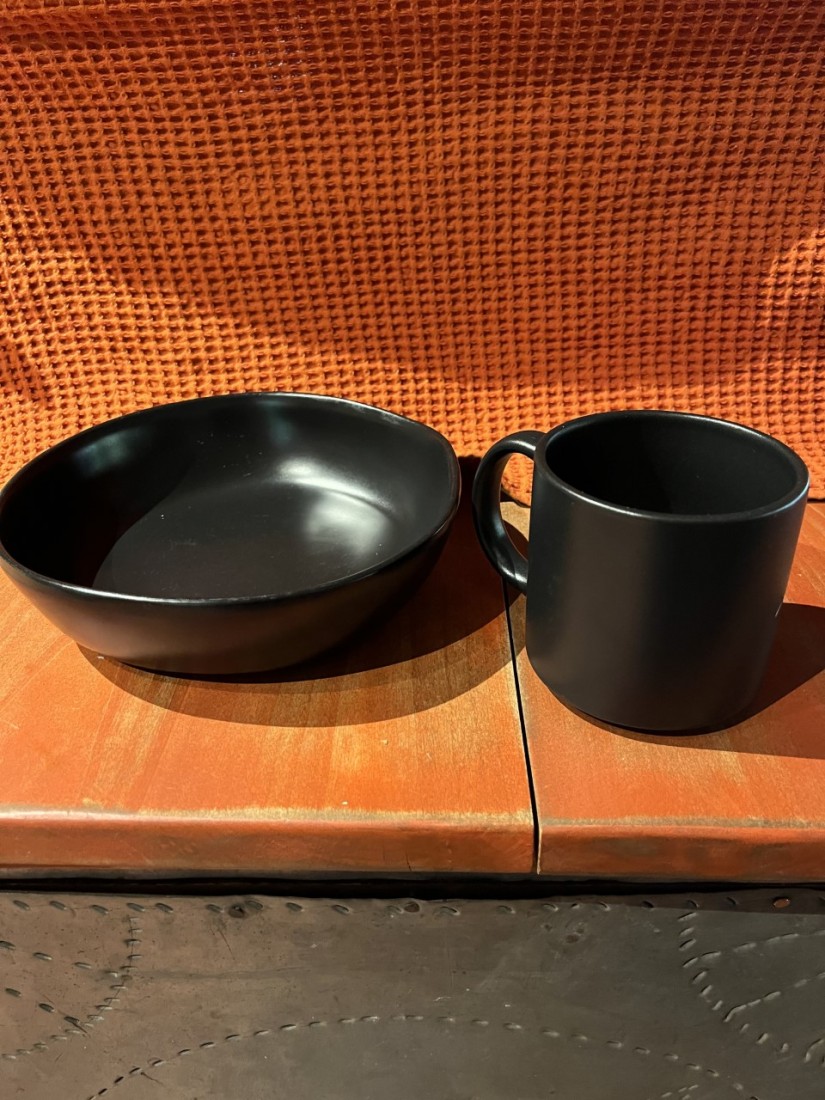 Planting Cole Crops and Garlic 3 Digging holes like a cereal bowl rather than a coffee cup helps roots navigate through their new location. (Photo: Peggy Singlemann)